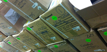 Some of the boxes that Roger and Robert Meyer Burnett have to sort through for Enterprise