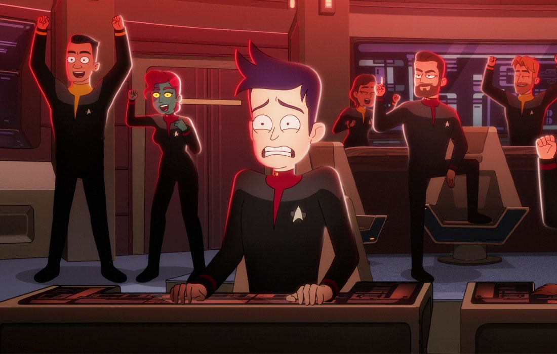 A terrifed looking cartoon Boimler grips the helm console in terror, while Captain Riker and the crew of the Titan cheer.